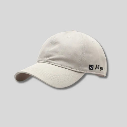 Soft top cap with side letter embroidery